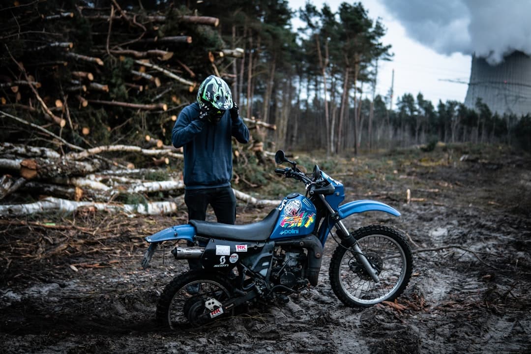 Enduro rider on technical forest terrain